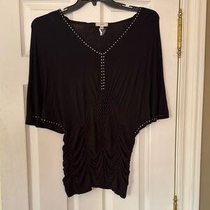 Vain black blouse with silver embellishment.